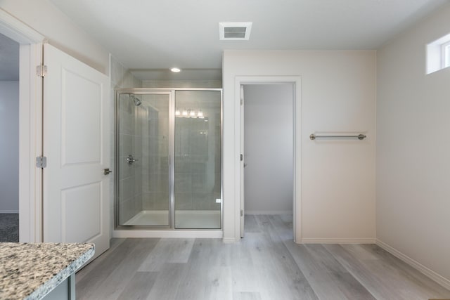 9600 Sage Ranch Ct SW, Albuquerque, NM 87121 - bathroom featuring wood finished floors and a shower stall