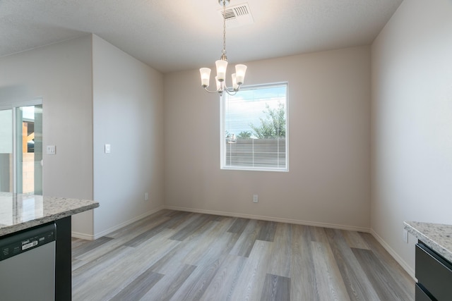 9504 Sage Ranch Ct SW, Albuquerque, NM 87121 - unfurnished dining area with light wood-type flooring and a chandelier