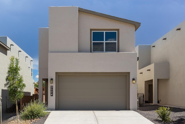 9504 Sage Ranch Ct SW, Albuquerque, NM 87121 - view of front facade featuring stucco siding, concrete driveway, and an attached garage
