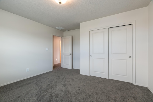 9504 Sage Ranch Ct SW, Albuquerque, NM 87121 - unfurnished bedroom with carpet flooring, a textured ceiling, and a closet