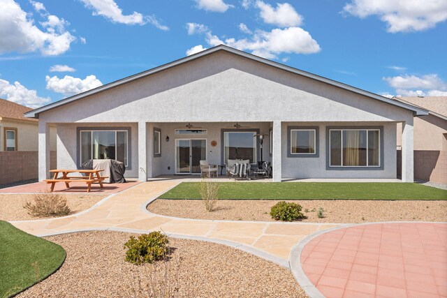 460 Rio Chama Cir SW, Los Lunas, NM 87031 - back of house featuring a patio area, stucco siding, and a ceiling fan