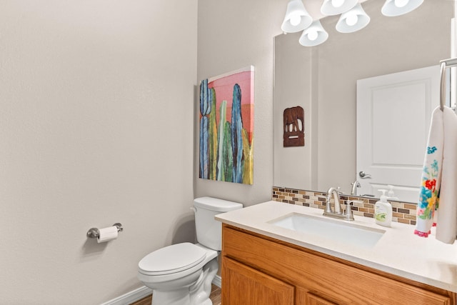 460 Rio Chama Cir SW, Los Lunas, NM 87031 - half bathroom with vanity, toilet, backsplash, and baseboards