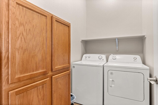 460 Rio Chama Cir SW, Los Lunas, NM 87031 - washroom with cabinet space and independent washer and dryer