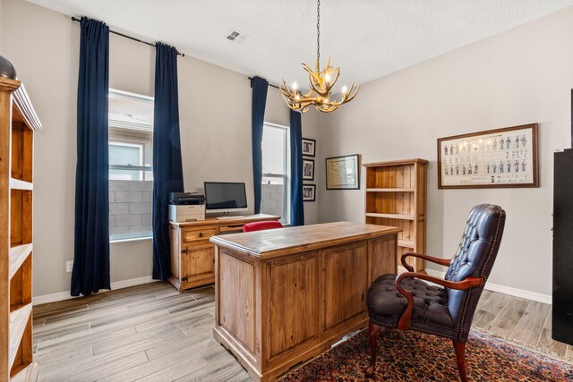 460 Rio Chama Cir SW, Los Lunas, NM 87031 - office featuring light wood-type flooring, a chandelier, and baseboards