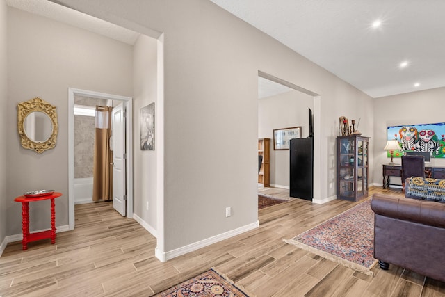 460 Rio Chama Cir SW, Los Lunas, NM 87031 - living room with light wood finished floors, baseboards, and recessed lighting