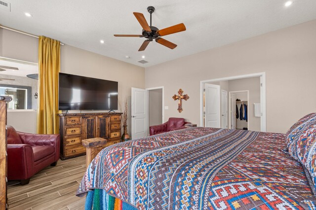460 Rio Chama Cir SW, Los Lunas, NM 87031 - bedroom featuring wood finished floors, ceiling fan, and recessed lighting