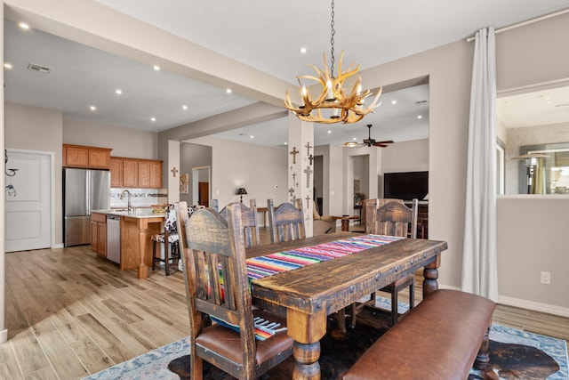 460 Rio Chama Cir SW, Los Lunas, NM 87031 - dining space featuring a chandelier, light wood-style floors, ceiling fan, recessed lighting, and baseboards