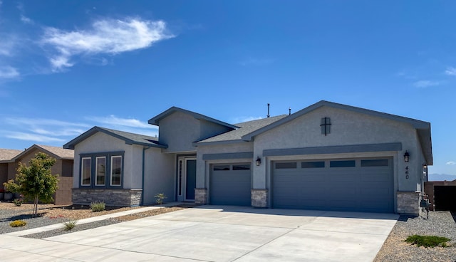 460 Rio Chama Cir SW, Los Lunas, NM 87031 - single story home with a garage, stone siding, concrete driveway, and stucco siding
