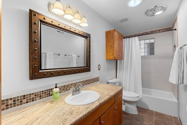 1125 Marigold Dr NE, Albuquerque, NM 87122 - full bathroom with visible vents, toilet, decorative backsplash, and vanity