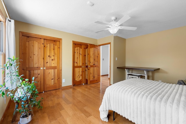 1125 Marigold Dr NE, Albuquerque, NM 87122 - bedroom featuring baseboards, a ceiling fan, and light wood-style floors