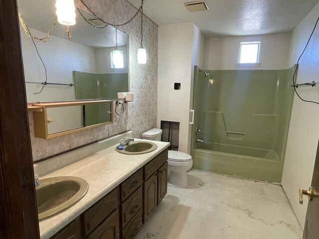 bathroom with unfinished concrete flooring,  shower combination, toilet, and a sink