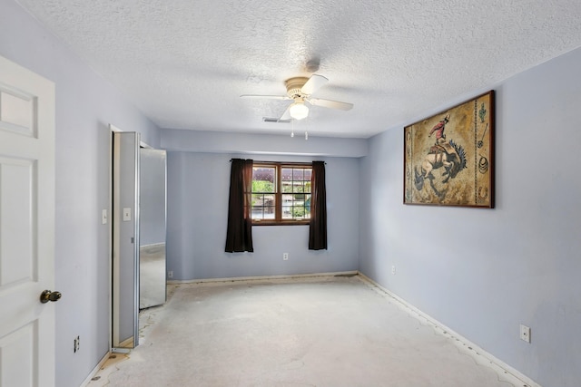 404 Pyrite Dr NE, Rio Rancho, NM 87124 - empty room featuring a ceiling fan, a textured ceiling, concrete floors, and baseboards