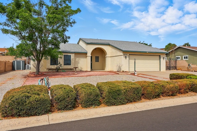 404 Pyrite Dr NE, Rio Rancho, NM 87124 - single story home with stucco siding, an attached garage, driveway, and central air condition unit