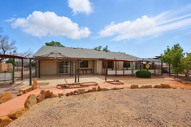 404 Pyrite Dr NE, Rio Rancho, NM 87124 - rear view of house featuring a patio area, a pergola, and a shingled roof