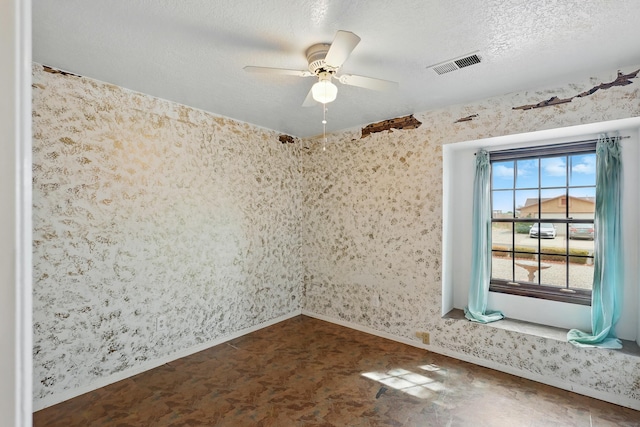 404 Pyrite Dr NE, Rio Rancho, NM 87124 - empty room featuring baseboards, a ceiling fan, a textured ceiling, and wallpapered walls