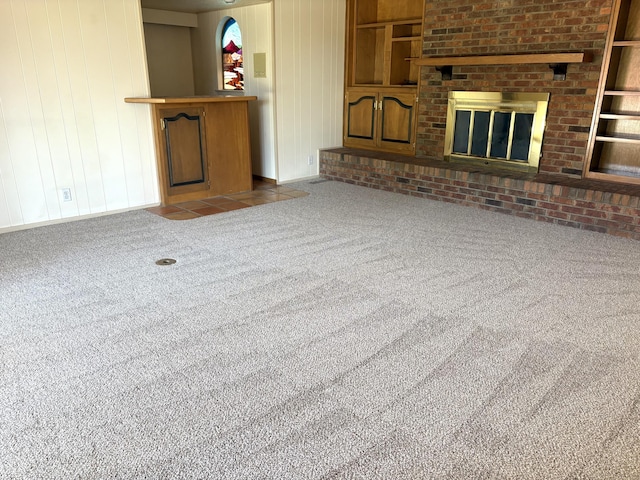 7827 Academy Trl NE, Albuquerque, NM 87109 - unfurnished living room featuring a fireplace, carpet floors, and baseboards