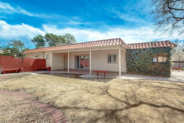 7827 Academy Trl NE, Albuquerque, NM 87109 - back of house featuring a tile roof, a patio area, and stucco siding