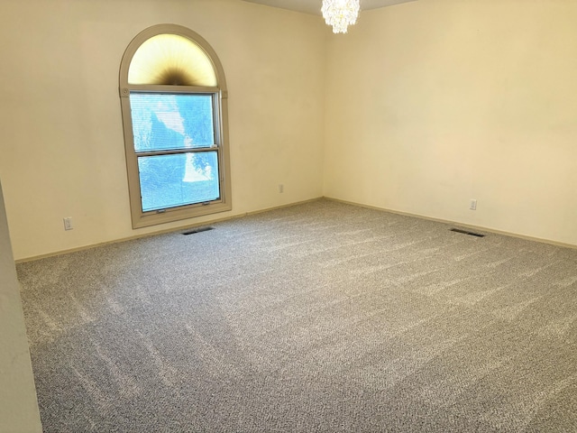 7827 Academy Trl NE, Albuquerque, NM 87109 - carpeted spare room featuring a chandelier and baseboards