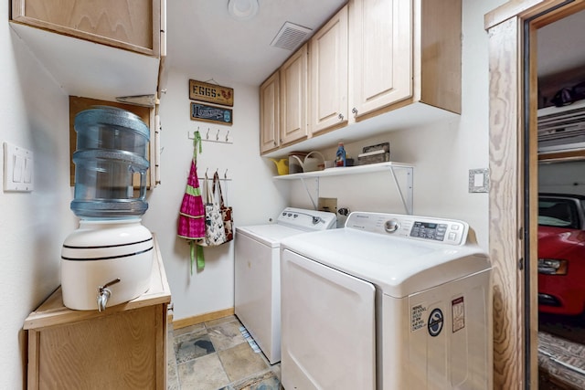 2544 Sandia Loop NE, Rio Rancho, NM 87144 - clothes washing area with visible vents, baseboards, stone finish floor, separate washer and dryer, and cabinet space