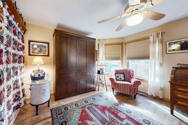 2544 Sandia Loop NE, Rio Rancho, NM 87144 - living area featuring visible vents, light wood-style floors, and ceiling fan