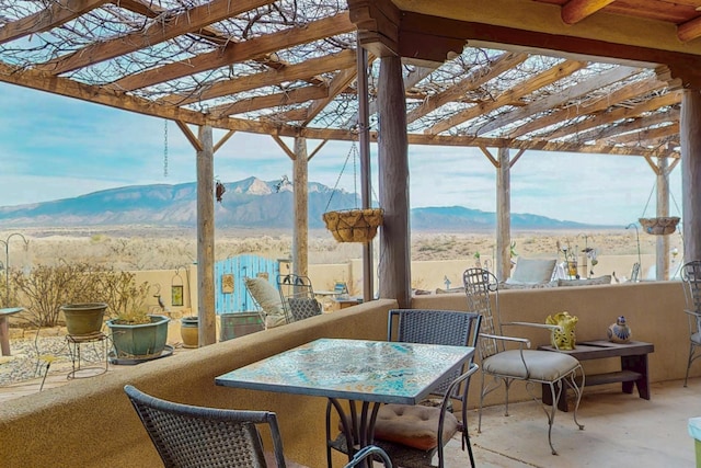 2544 Sandia Loop NE, Rio Rancho, NM 87144 - view of patio with a pergola and a mountain view