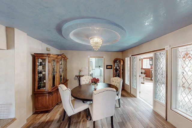 dining area featuring light wood finished floors