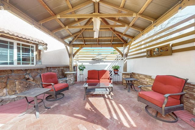 view of patio / terrace with an outdoor living space and a gazebo