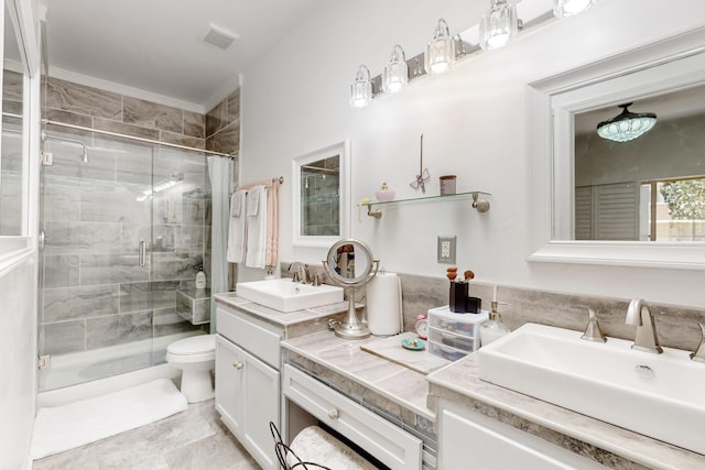 full bath with a stall shower, toilet, vanity, visible vents, and ornamental molding