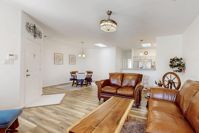 living room featuring baseboards and wood finished floors