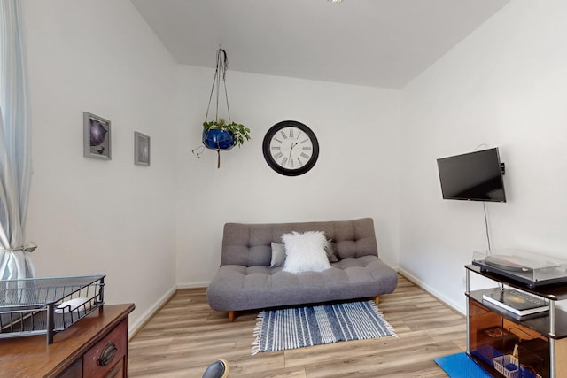 sitting room with light wood finished floors and baseboards