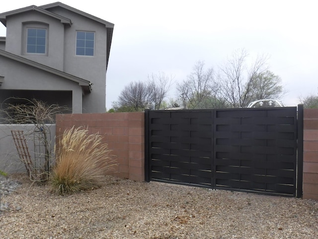 view of gate featuring fence