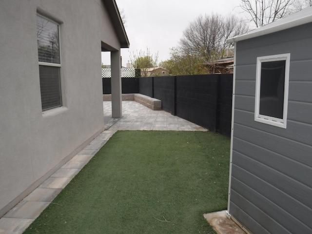 view of yard featuring a fenced backyard and a patio