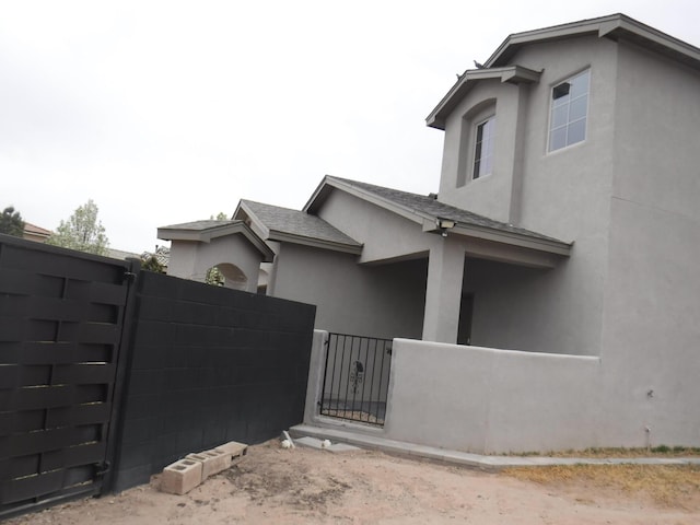 view of gate with fence