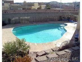 4104 Killington Rd NW, Albuquerque, NM 87114 - view of swimming pool with a fenced backyard and a patio