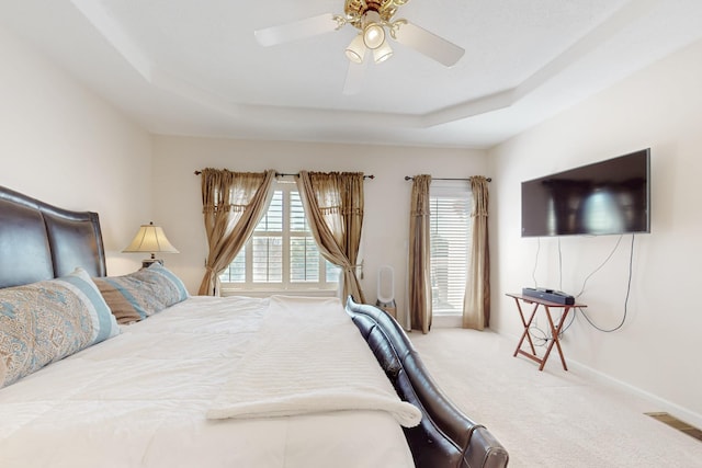 4104 Killington Rd NW, Albuquerque, NM 87114 - carpeted bedroom with a tray ceiling and a ceiling fan