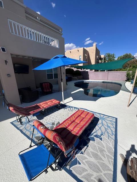 4104 Killington Rd NW, Albuquerque, NM 87114 - view of swimming pool with a patio and a fenced backyard