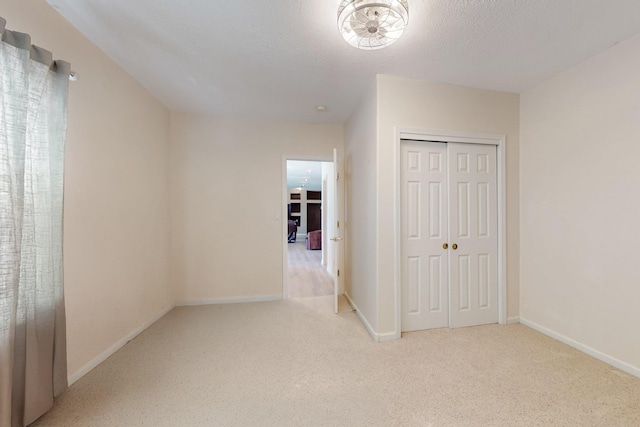 4104 Killington Rd NW, Albuquerque, NM 87114 - unfurnished bedroom with carpet flooring, a closet, and baseboards