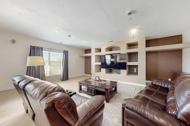 4104 Killington Rd NW, Albuquerque, NM 87114 - living room featuring a textured ceiling and baseboards