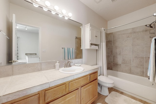 4104 Killington Rd NW, Albuquerque, NM 87114 - full bath with shower / bath combo with shower curtain, vanity, toilet, and wood finished floors