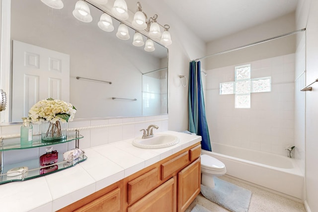 4104 Killington Rd NW, Albuquerque, NM 87114 - bathroom featuring toilet, shower / bath combo with shower curtain, and vanity