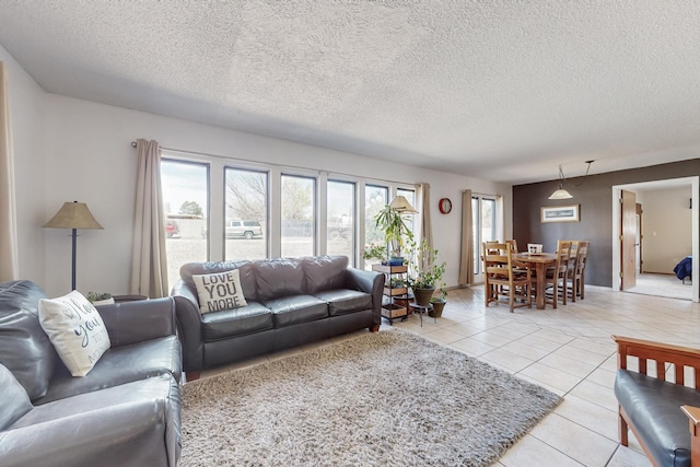 5208 Simon Dr NW, Albuquerque, NM 87114 - living area with light tile patterned floors and a textured ceiling