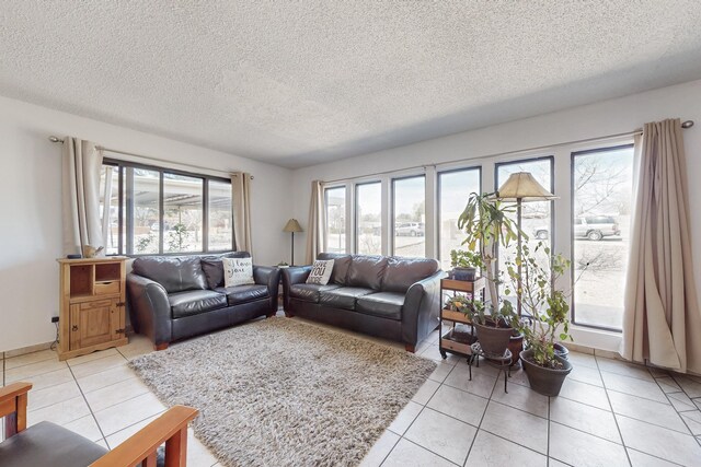 5208 Simon Dr NW, Albuquerque, NM 87114 - living area featuring plenty of natural light, a textured ceiling, and light tile patterned floors