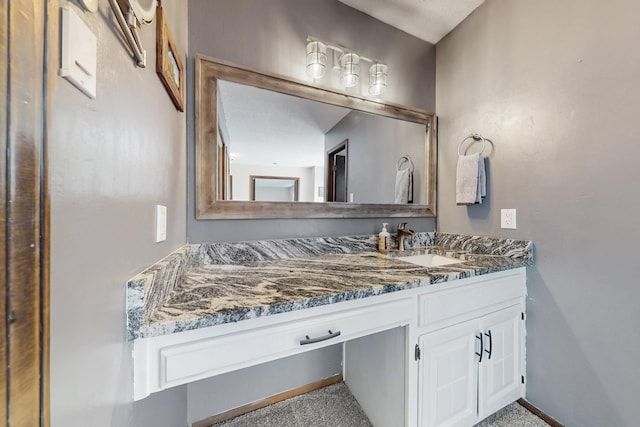 5208 Simon Dr NW, Albuquerque, NM 87114 - bathroom featuring vanity and baseboards