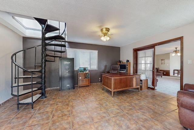 5208 Simon Dr NW, Albuquerque, NM 87114 - tiled home office featuring a textured ceiling and ceiling fan