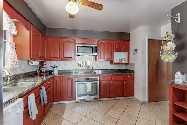 5208 Simon Dr NW, Albuquerque, NM 87114 - kitchen featuring open shelves, light tile patterned flooring, tasteful backsplash, a sink, and appliances with stainless steel finishes