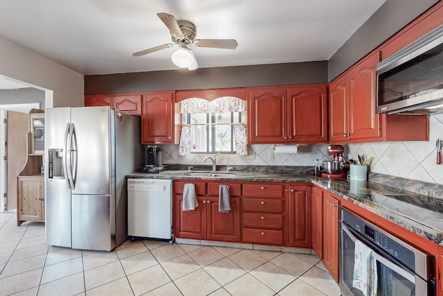 5208 Simon Dr NW, Albuquerque, NM 87114 - kitchen with a sink, appliances with stainless steel finishes, backsplash, and ceiling fan