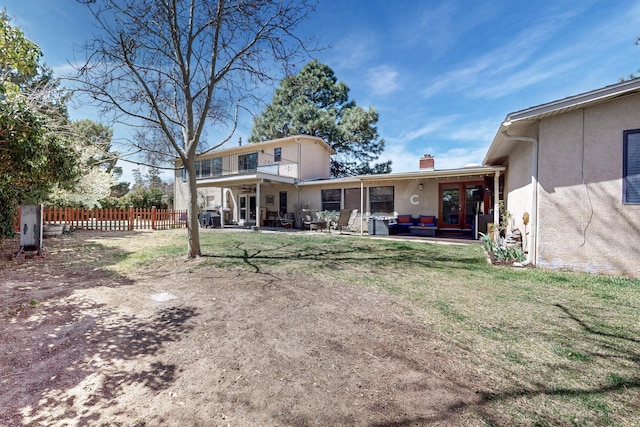 5208 Simon Dr NW, Albuquerque, NM 87114 - back of property with an outdoor living space, a ceiling fan, a chimney, a patio area, and fence