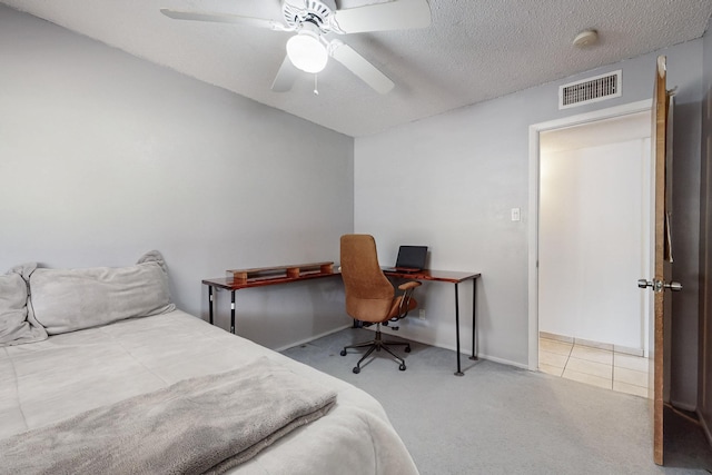 5208 Simon Dr NW, Albuquerque, NM 87114 - carpeted bedroom featuring baseboards, a ceiling fan, a textured ceiling, and visible vents