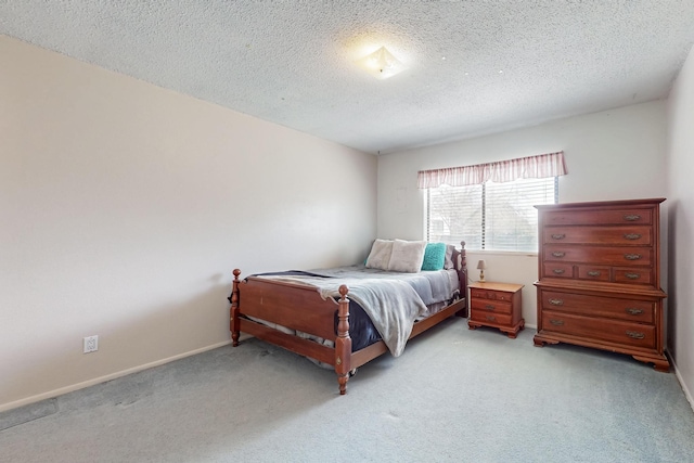 5208 Simon Dr NW, Albuquerque, NM 87114 - bedroom featuring baseboards, a textured ceiling, and light carpet