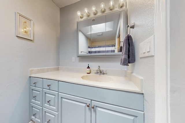 5208 Simon Dr NW, Albuquerque, NM 87114 - bathroom featuring vanity and curtained shower